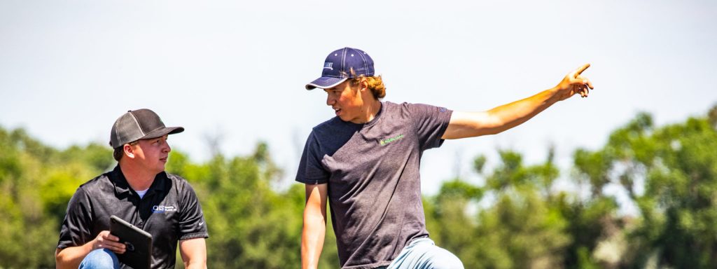 Two agronomists in a field